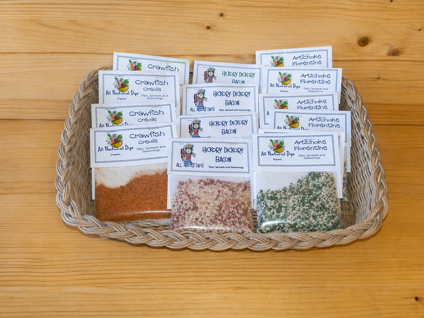 Basket filled with All Natural Dips packets including Crawfish Creole, Hickory Dickory Bacon and Artichoke Florentine